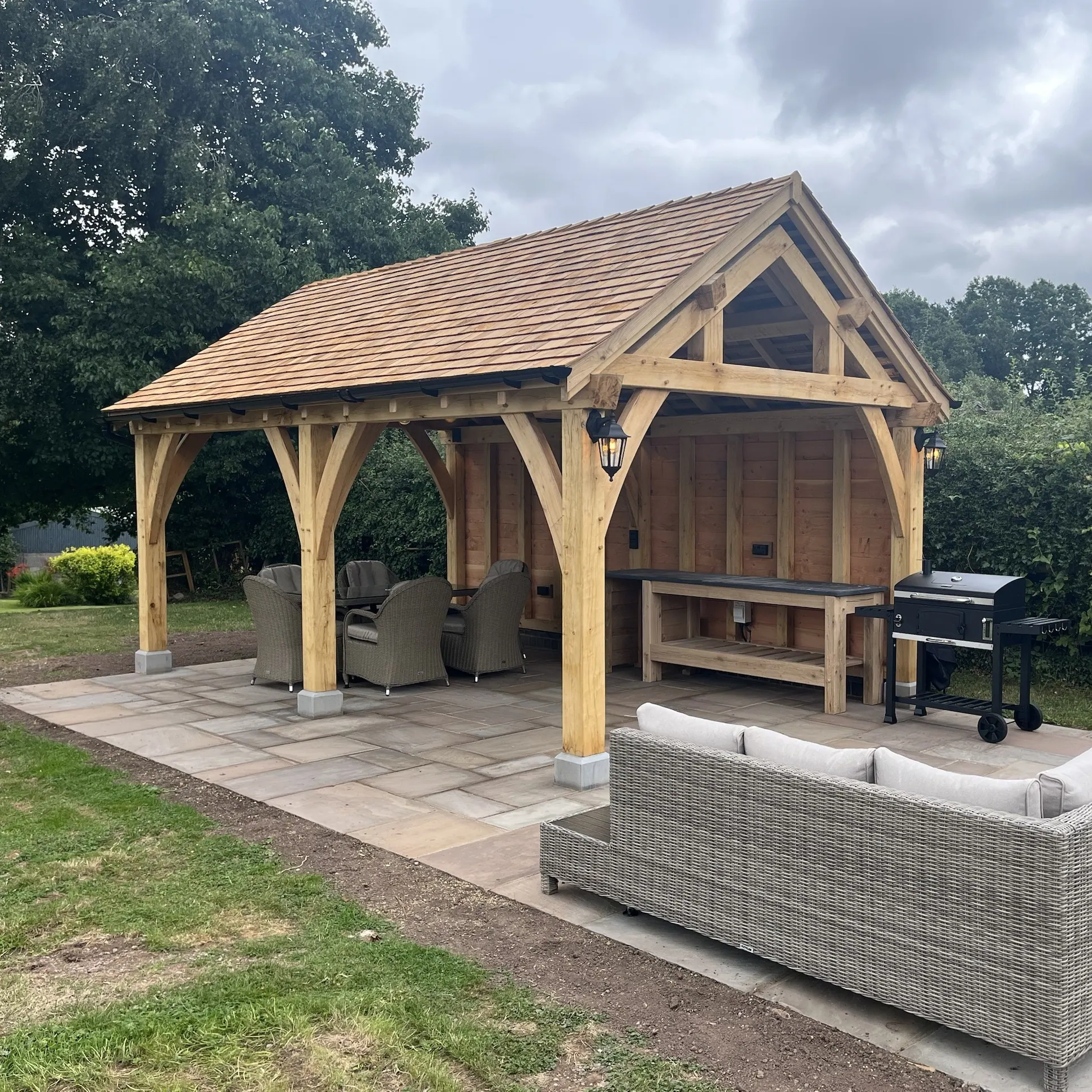 Oak frame garden pavilion with a cedar shingle roof at Woods Farmstead, Raglan.