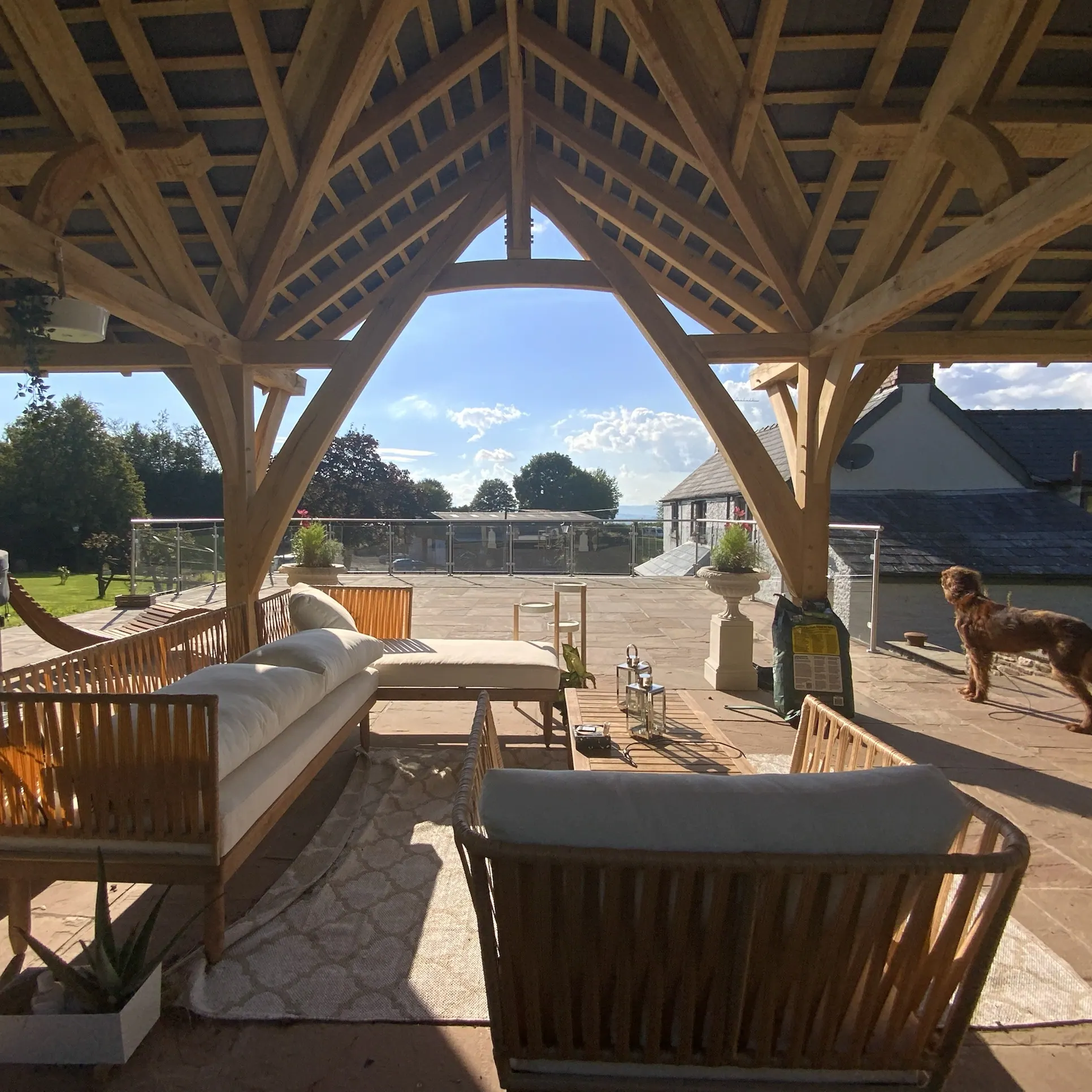 Oak frame garden pavilion built around curved crucks at Devauden, Monmouthshire.