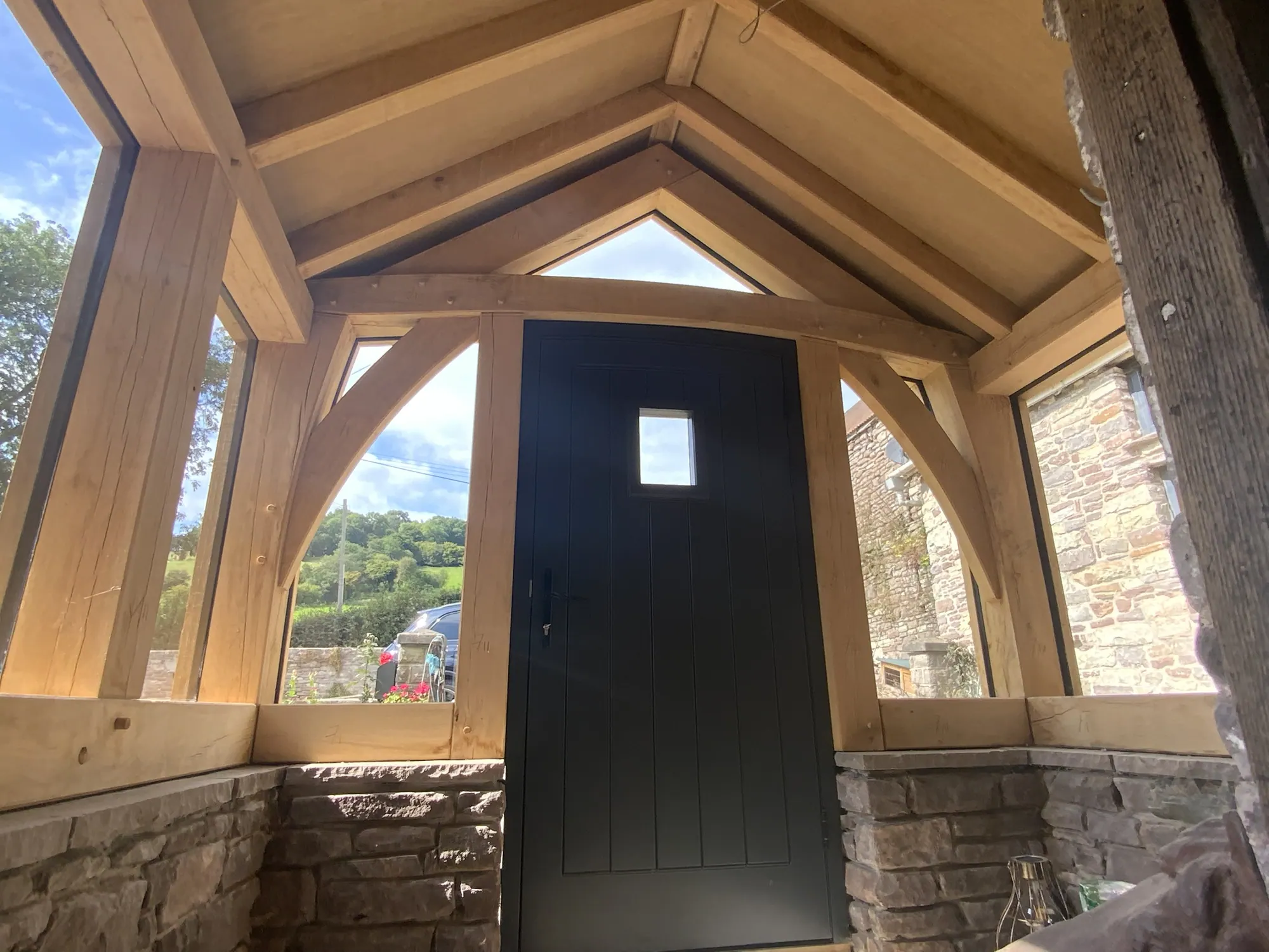 Inside the glazed oak porch at Llanbedr, looking at the front door