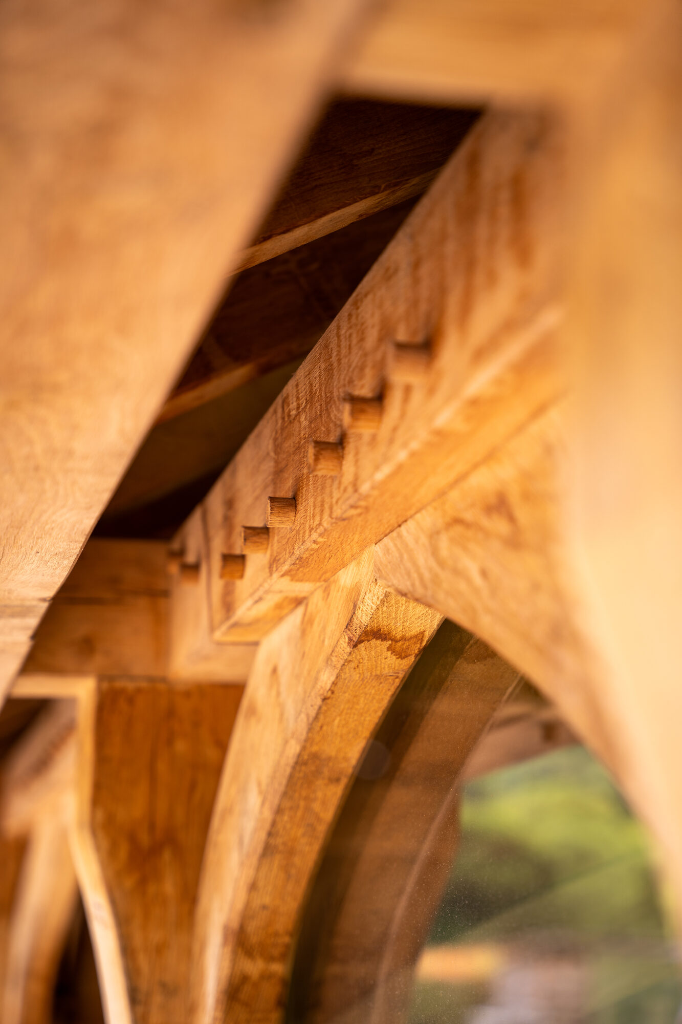 Close view of an oak brace and a pegged joint on an open porch near Usk