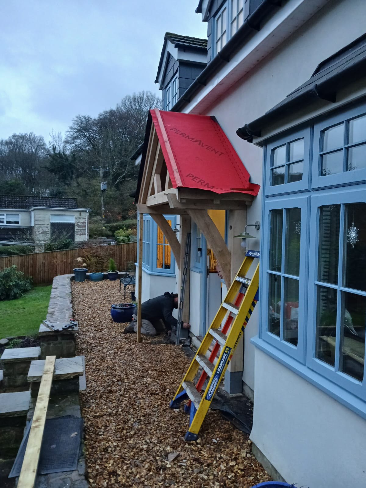 An oak porch at Tintern during the build, with its roof membrane on