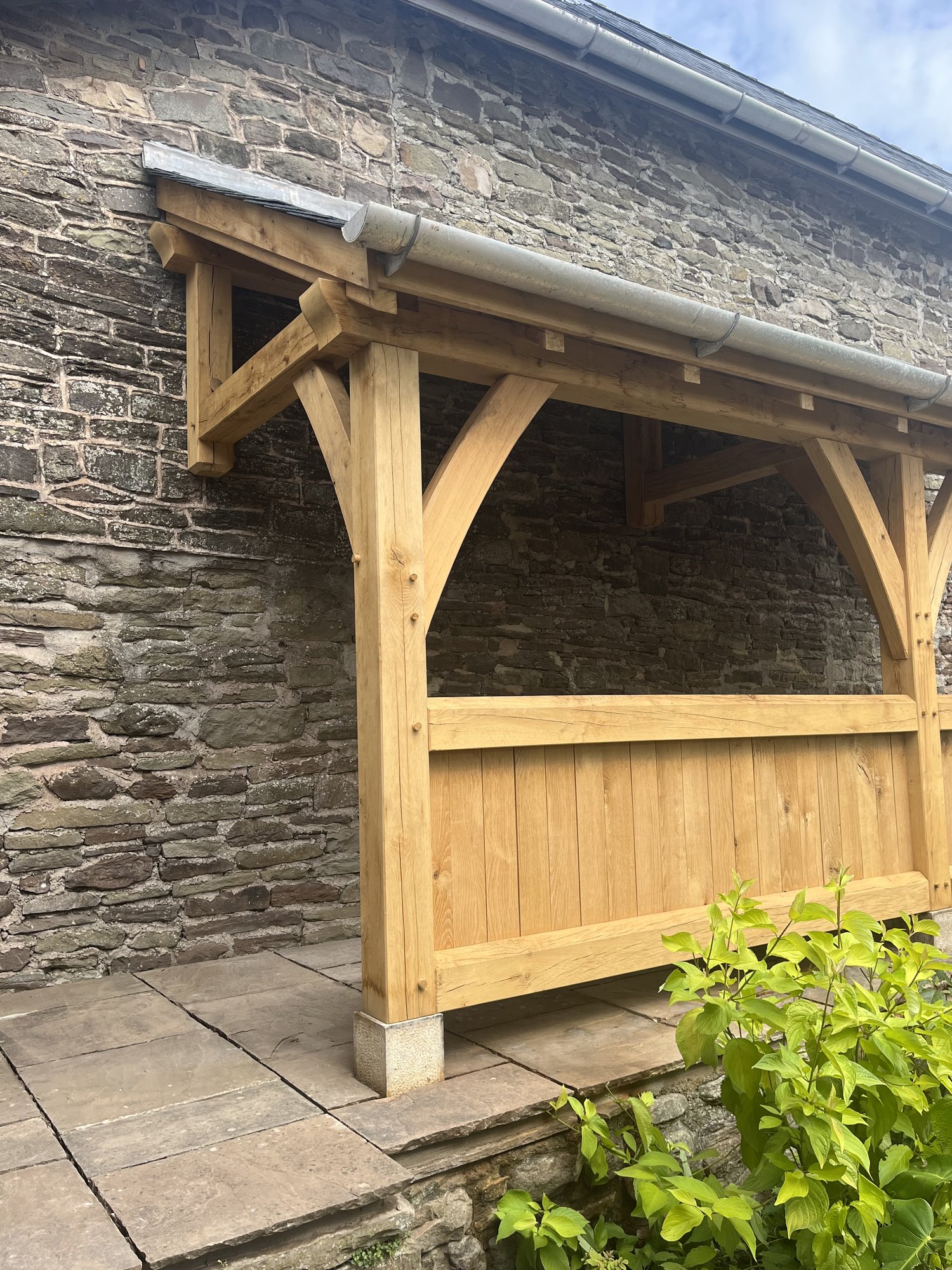 Close view of the oak balustrade and posts of the veranda at Llanvetherine.