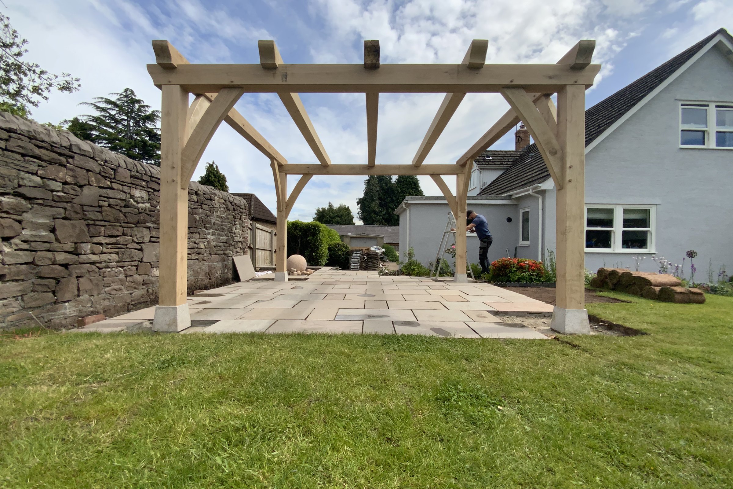 Freestanding oak pergola on a new paved terrace at Abergavenny