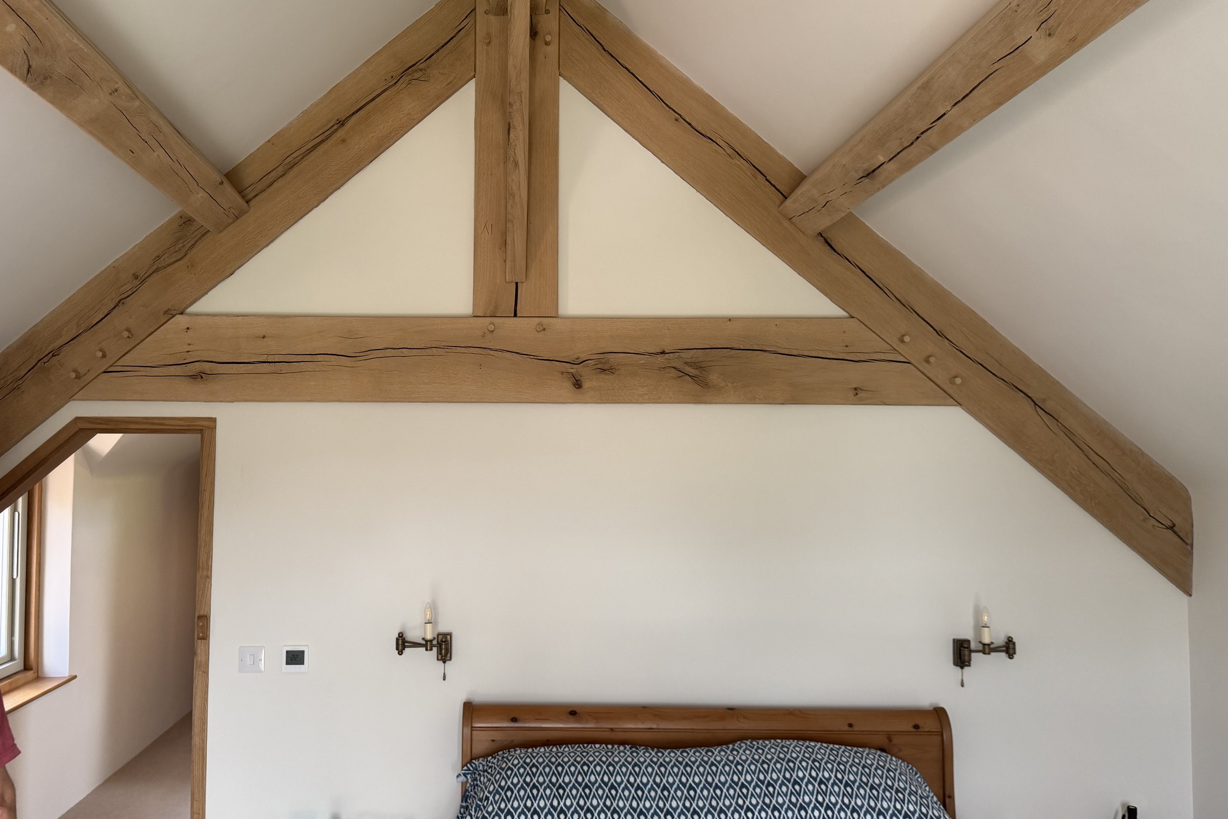 Oak roof trusses over a bedroom in a new house at Brockweir