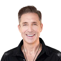 Smiling middle-aged man with neatly styled brown hair wearing a black shirt and necklace.