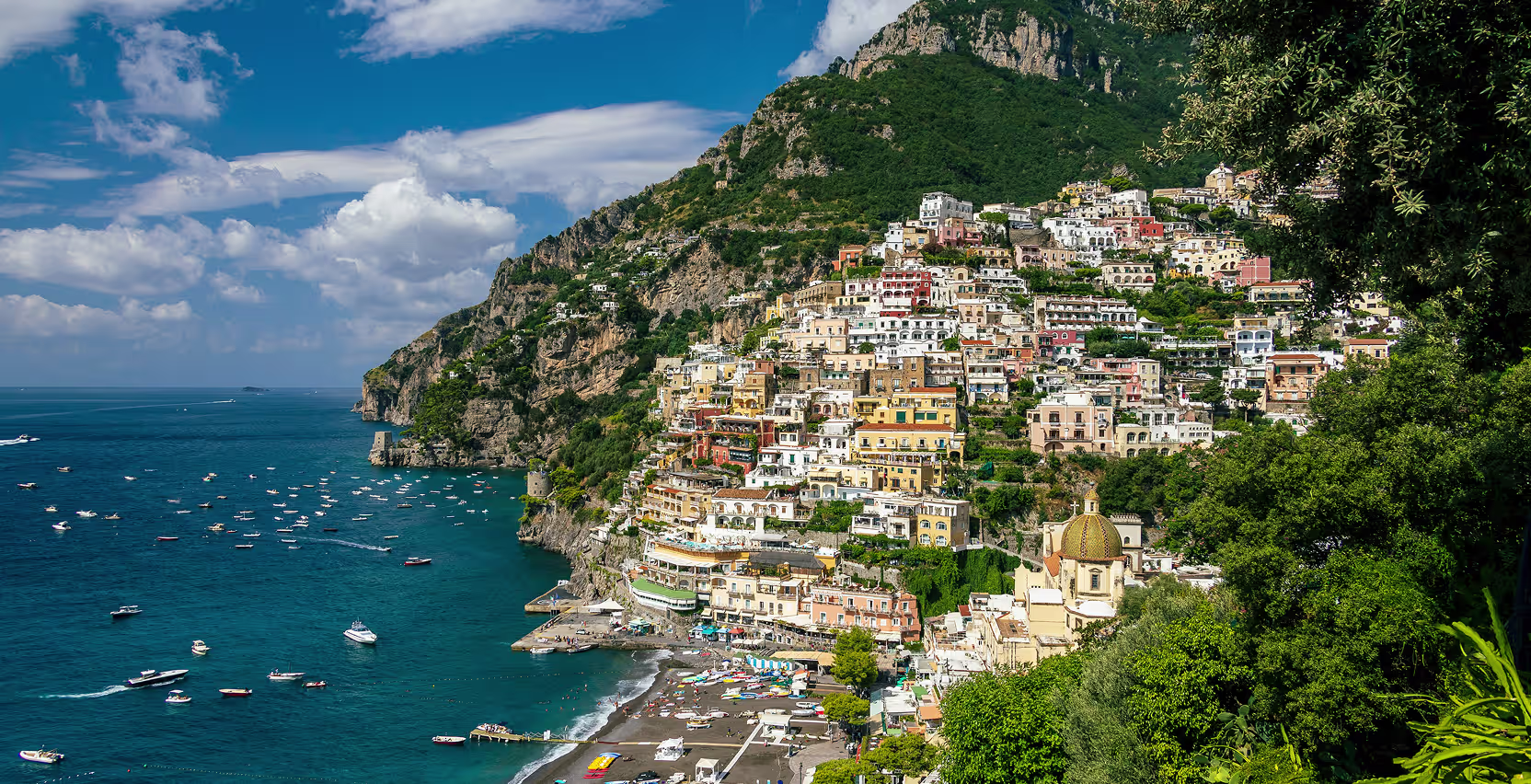 Guests relaxing on yacht deck along Amalfi Coast