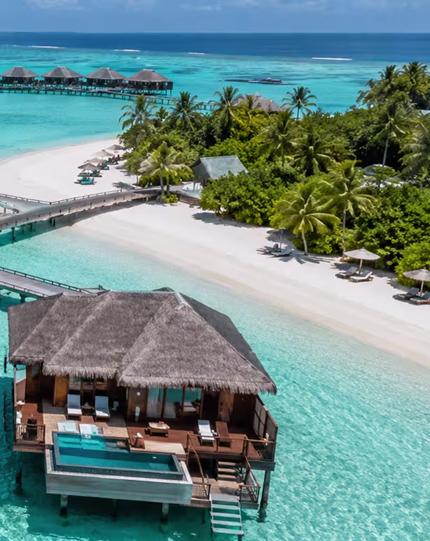 Aerial view of Maldives overwater villas and turquoise lagoon