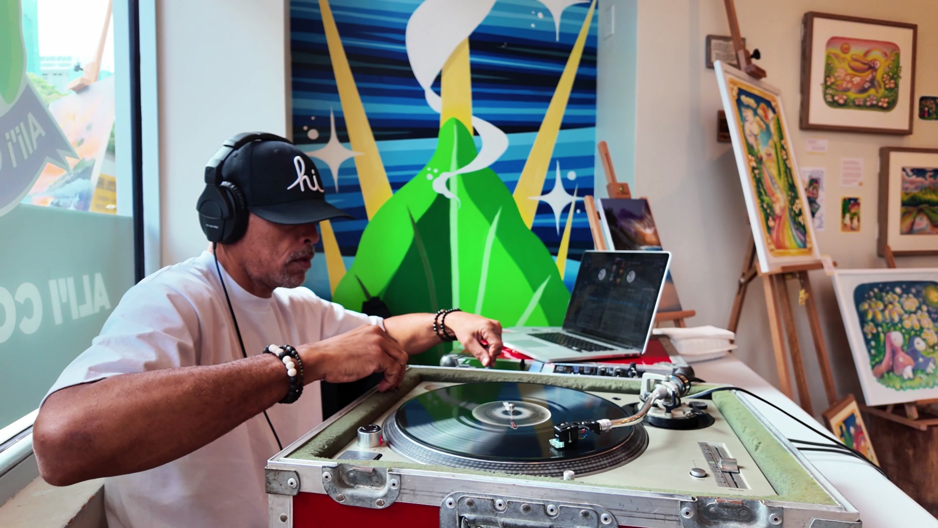 DJ DV spinning vinyl at the Aliʻi Coffee Co. pop-up