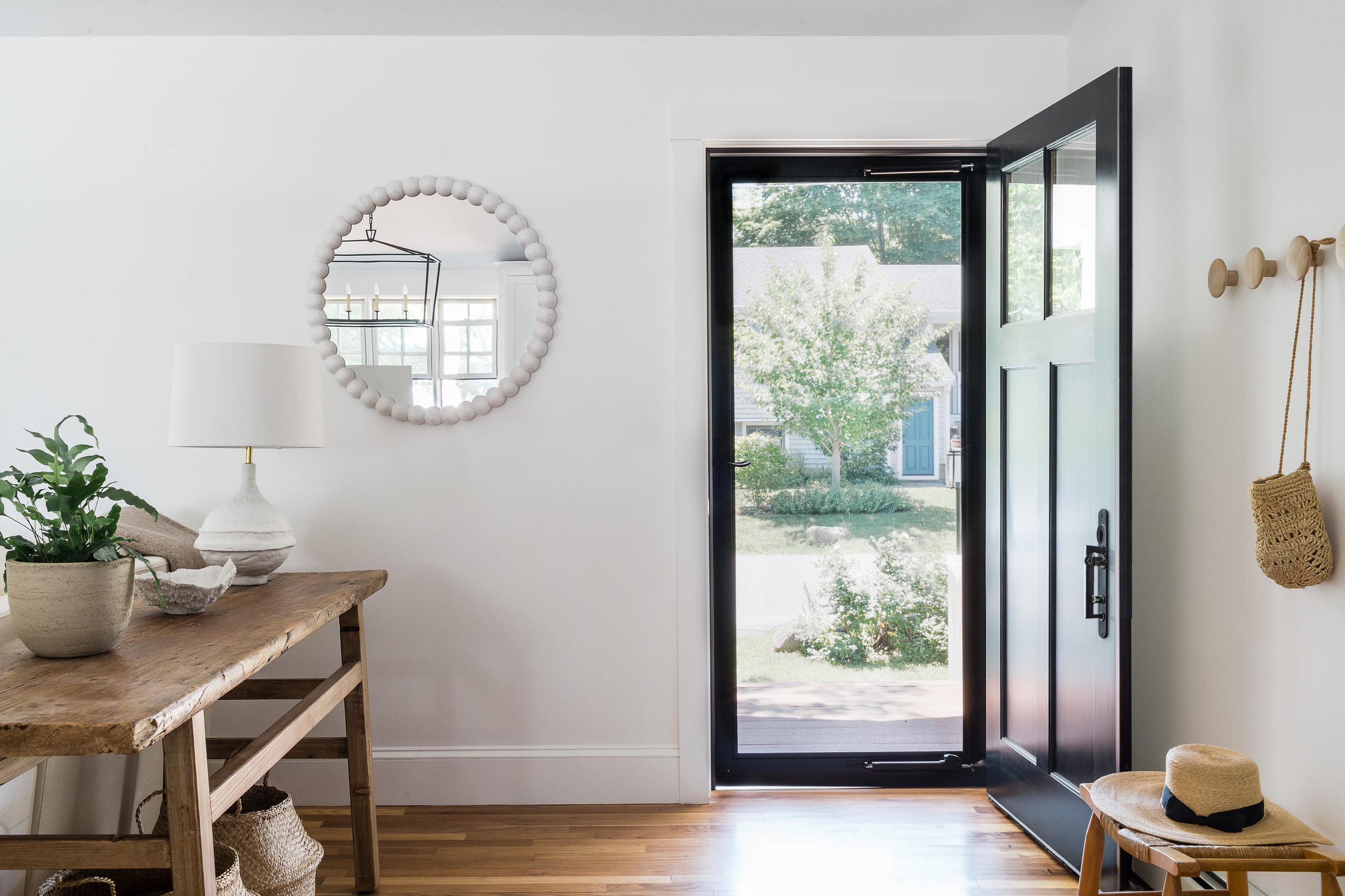 Lead image — the vestibule, electrochromic glass clearing to reveal the floor