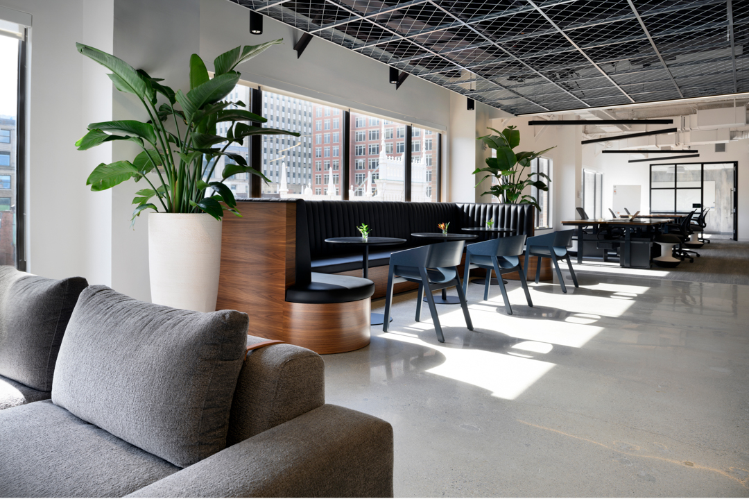 Custom tufted vegan leather banquette with walnut veneer framing