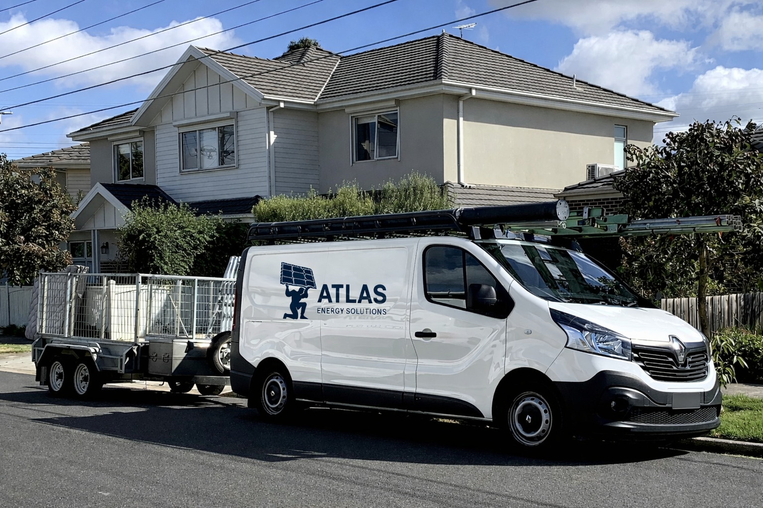 Van with trailer in front of house 
