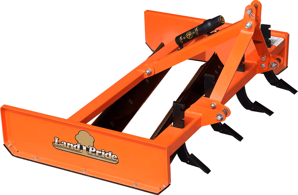 Orange grading attachment with wide steel blade on a white studio background.