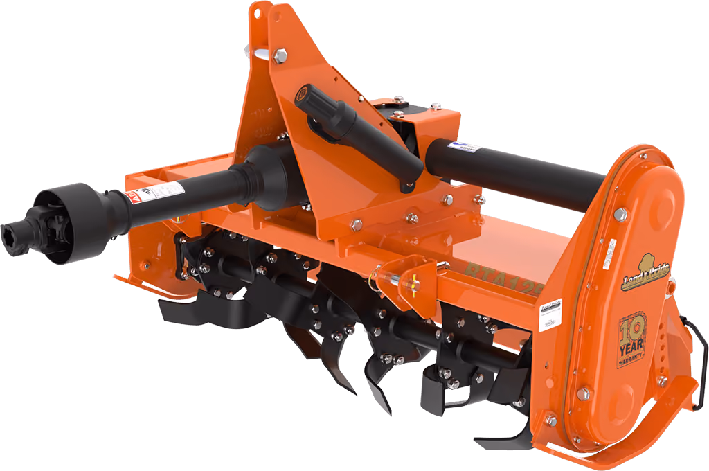 Orange rotary tiller attachment for breaking up soil on a white studio background.