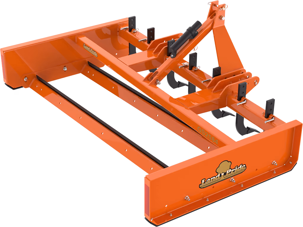 Orange grading attachment with wide steel blade on a white studio background.