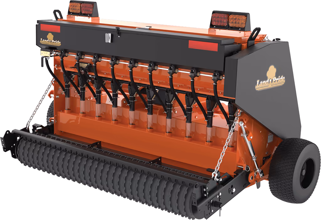 Orange seeder attachment for preparing and planting soil on a white studio background.