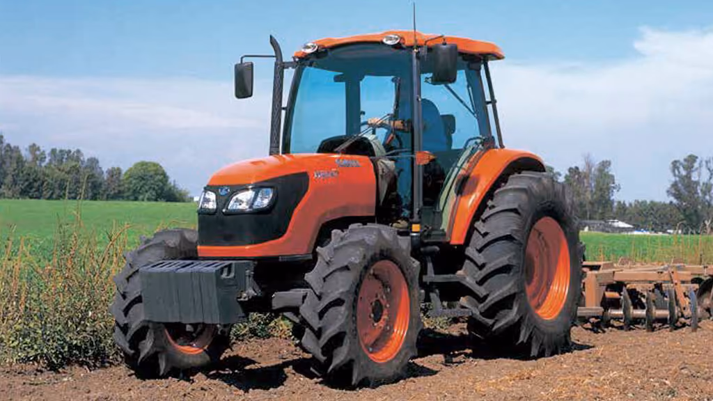 Orange Kubota tractor with roll-over protection.