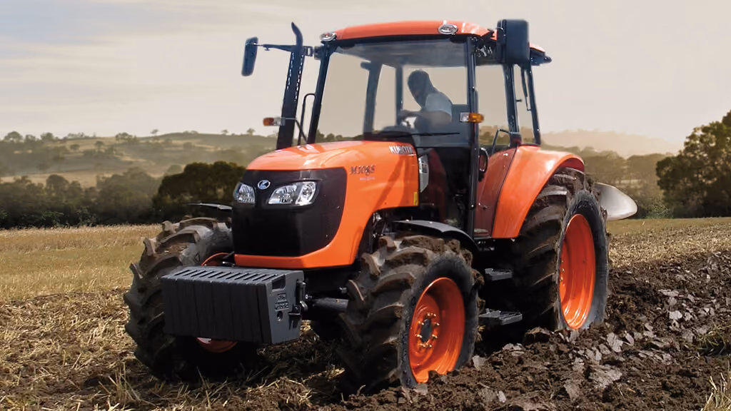 Orange Kubota tractor with roll-over protection.