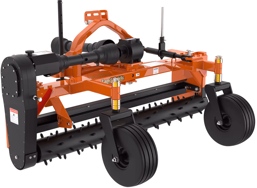Orange rake attachment with rows of steel tines on a white studio background.