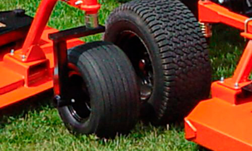 Detail highlighting Non-caster rear wing deck wheels on Grooming Mowers AFM42 Series.