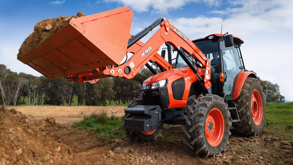 Orange Kubota tractor with roll-over protection.