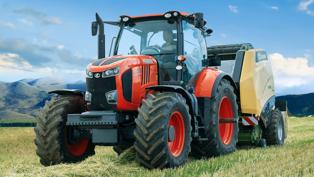 Orange Kubota tractor with roll-over protection.