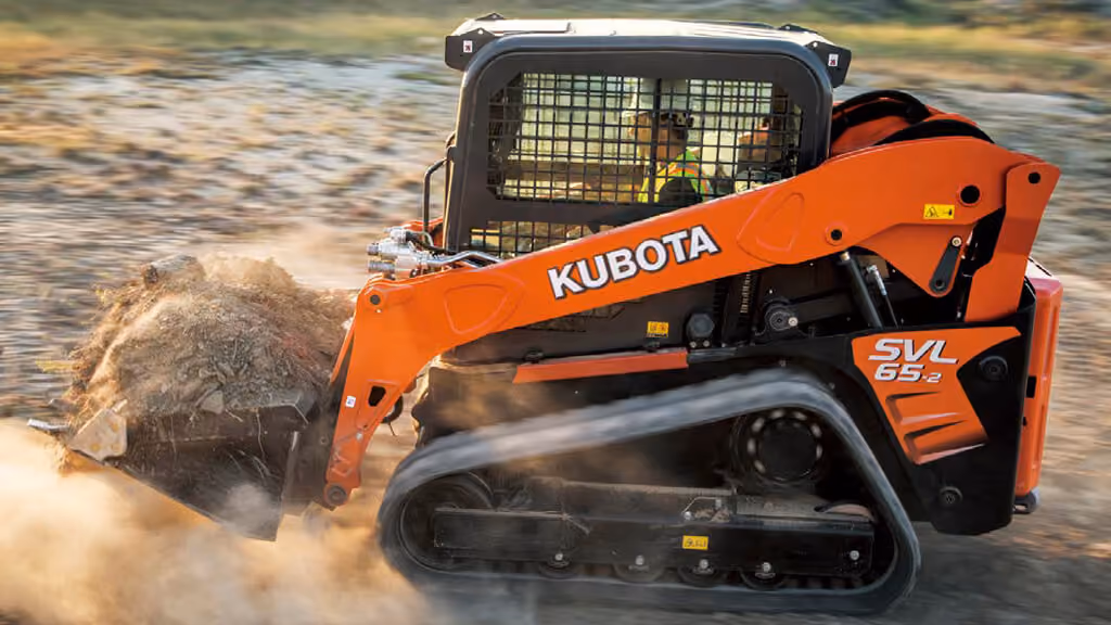Orange Kubota compact track loader with front bucket.