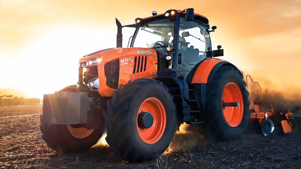 Orange Kubota tractor with roll-over protection.