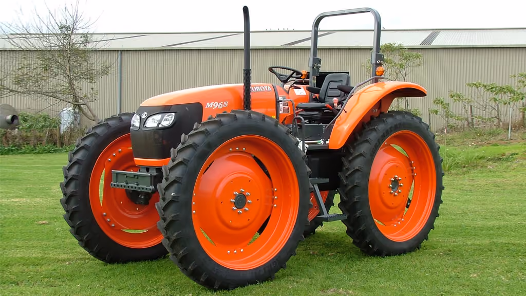 Orange Kubota tractor with roll-over protection.