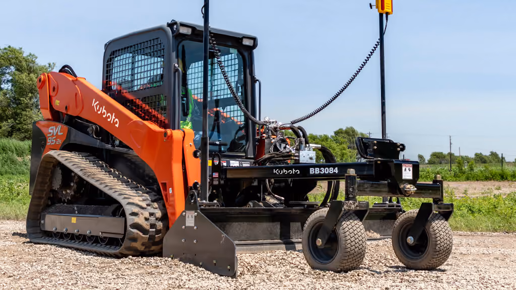 Orange grading attachment with wide steel blade.