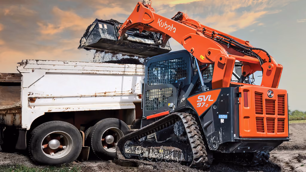 Orange Kubota compact track loader with front bucket.