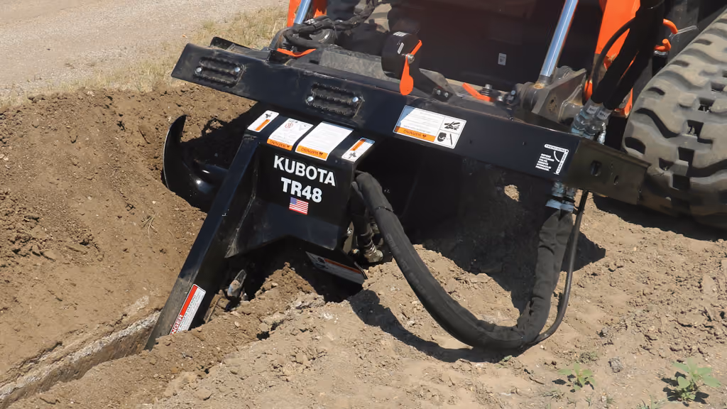 Trencher attachment with digging chain.