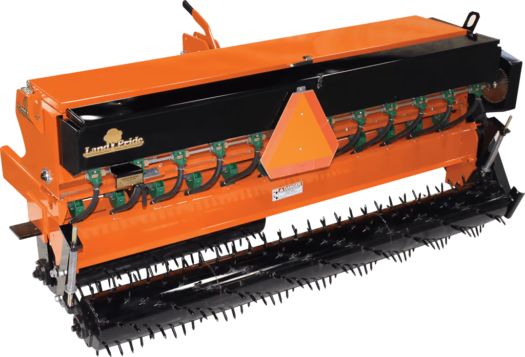 Orange seeder attachment for preparing and planting soil on a white studio background.