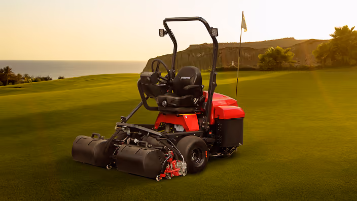 Orange Kubota mower with cutting deck.