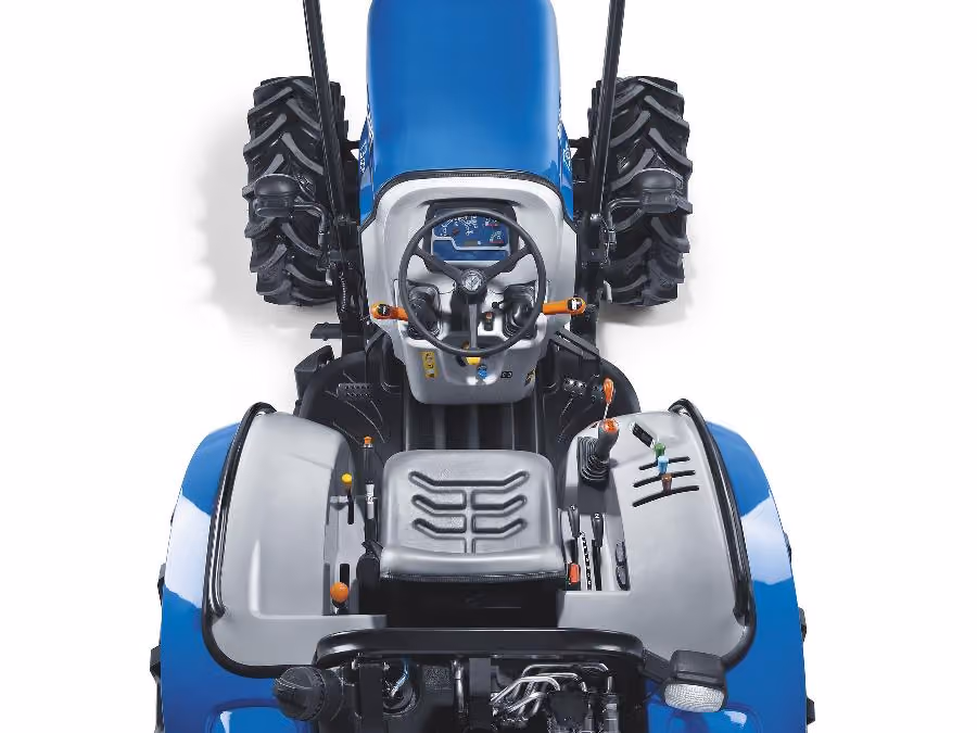 Overhead view of the New Holland T3F operator platform, showing the suspended seat, steering wheel and fender-mounted controls.