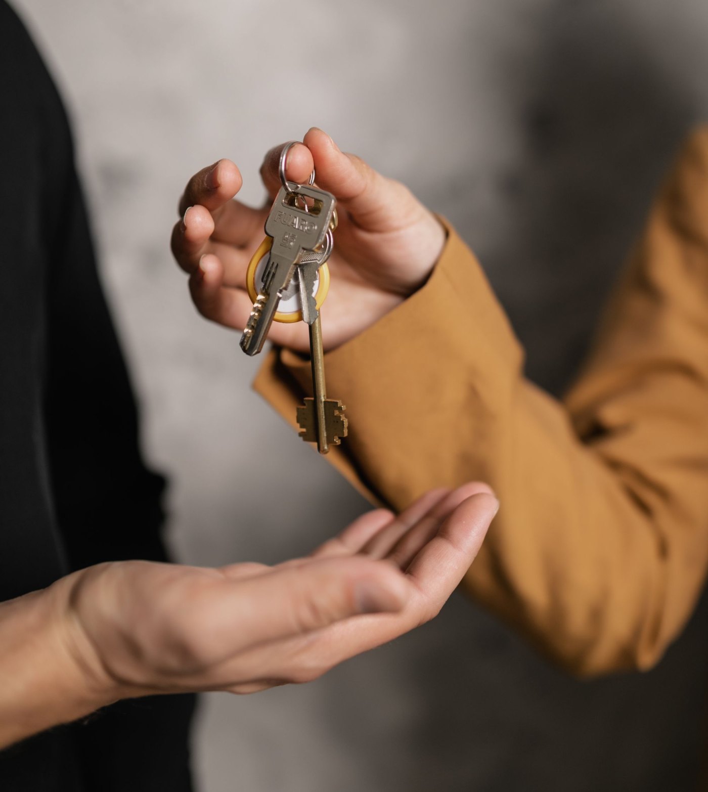 CentreKey property manager handing condo keys to a new tenant during white-glove onboarding