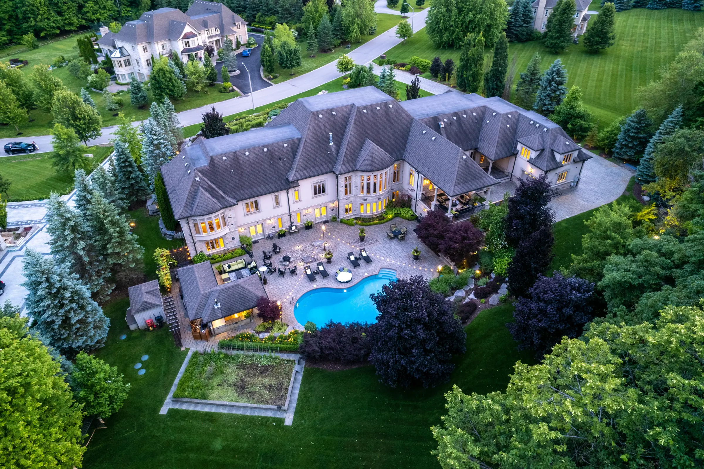 Aerial view of a private estate with grounds and pool in the GTA