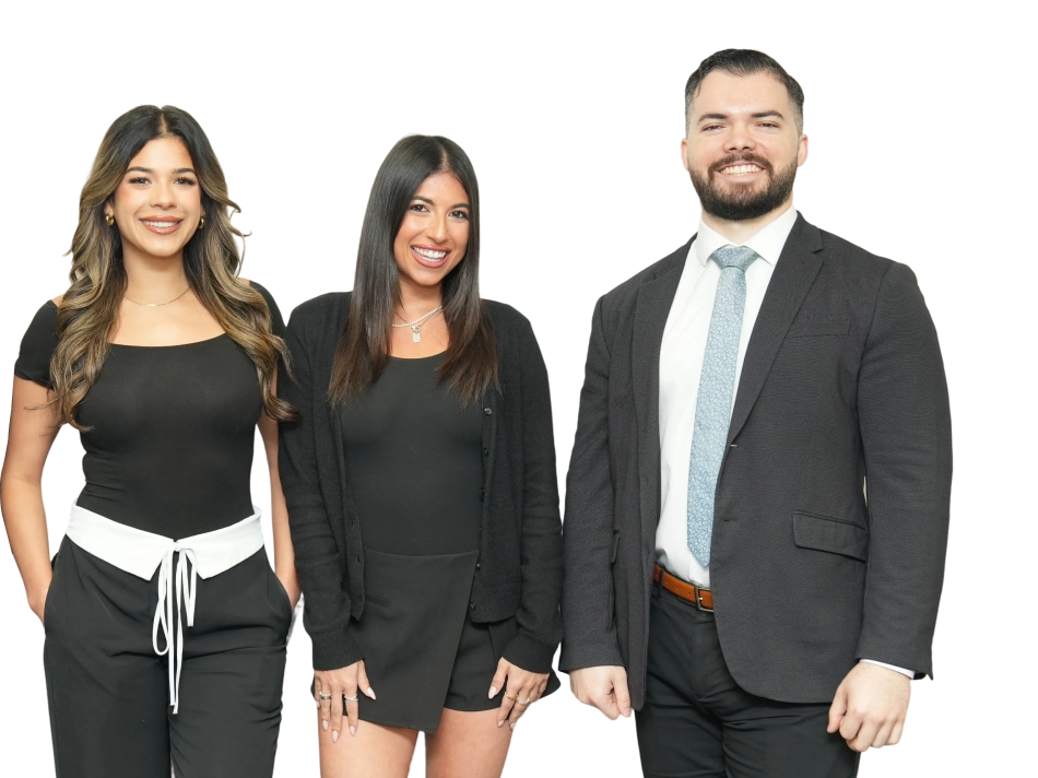 Three smiling adults dressed in black and white business casual and formal attire standing side by side.