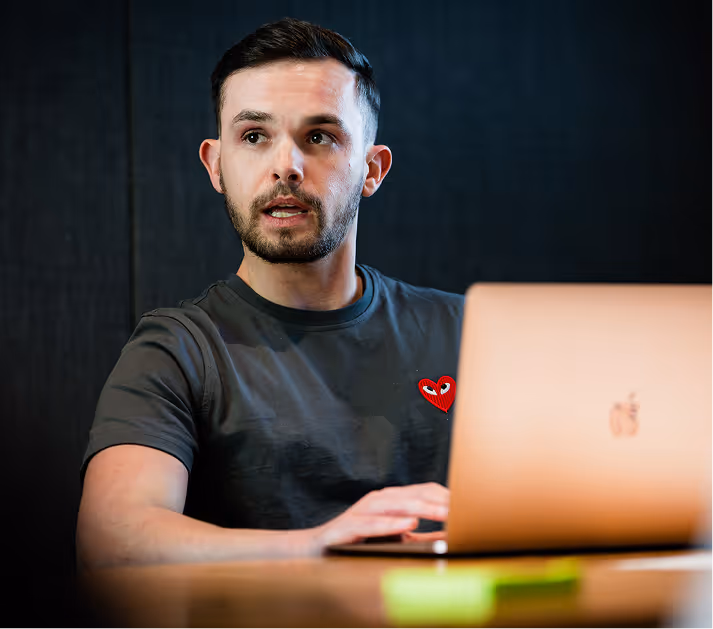 EDIFAI team member working on laptop