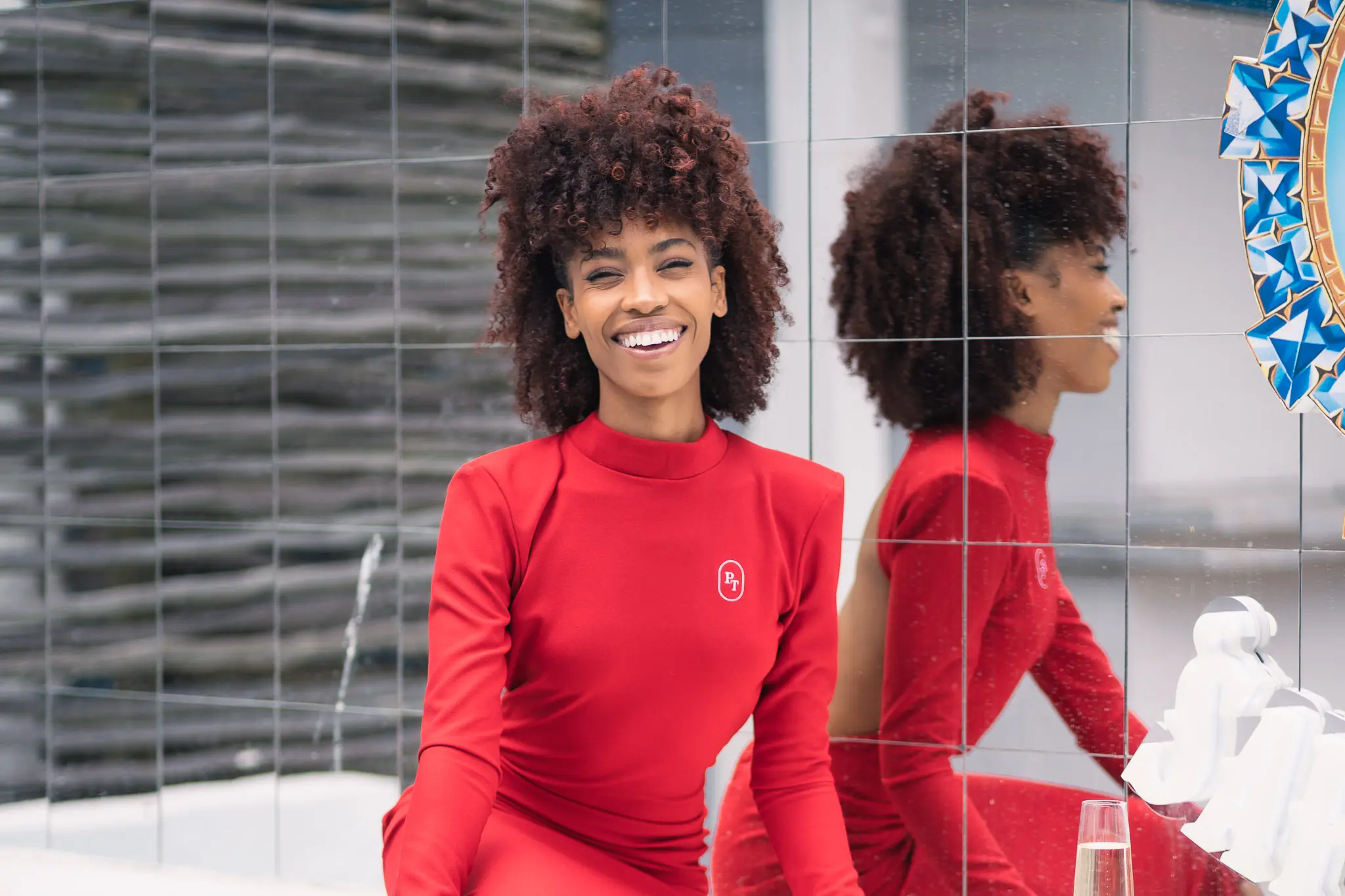 Cape Town photographer Marko Haas shoots Ruby, founder of Pretty Tax, in a red branded dress against a mirrored tile wall — personal branding portrait session, Cape Town 2025