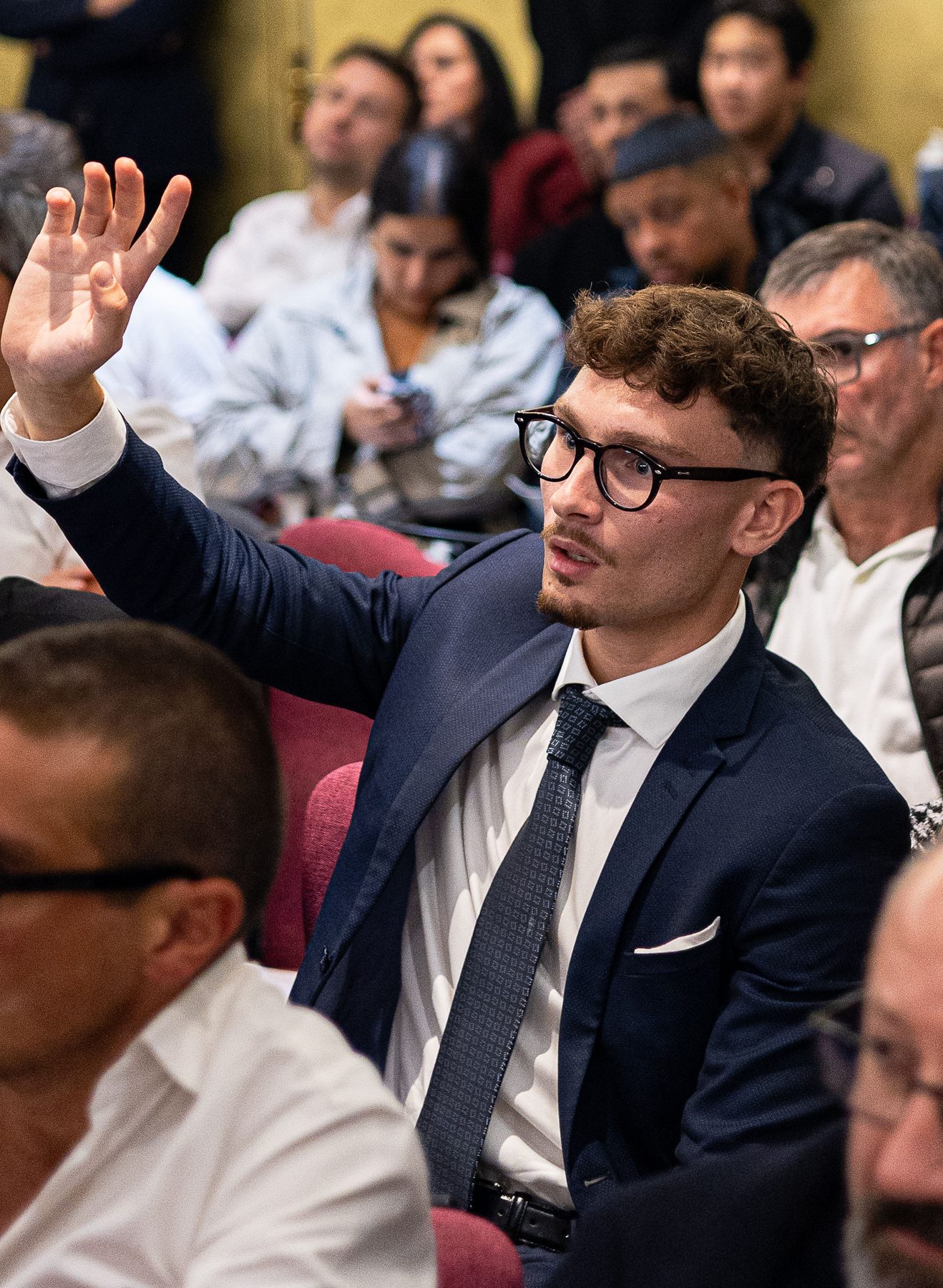 A participant asking a question during the Q&A session