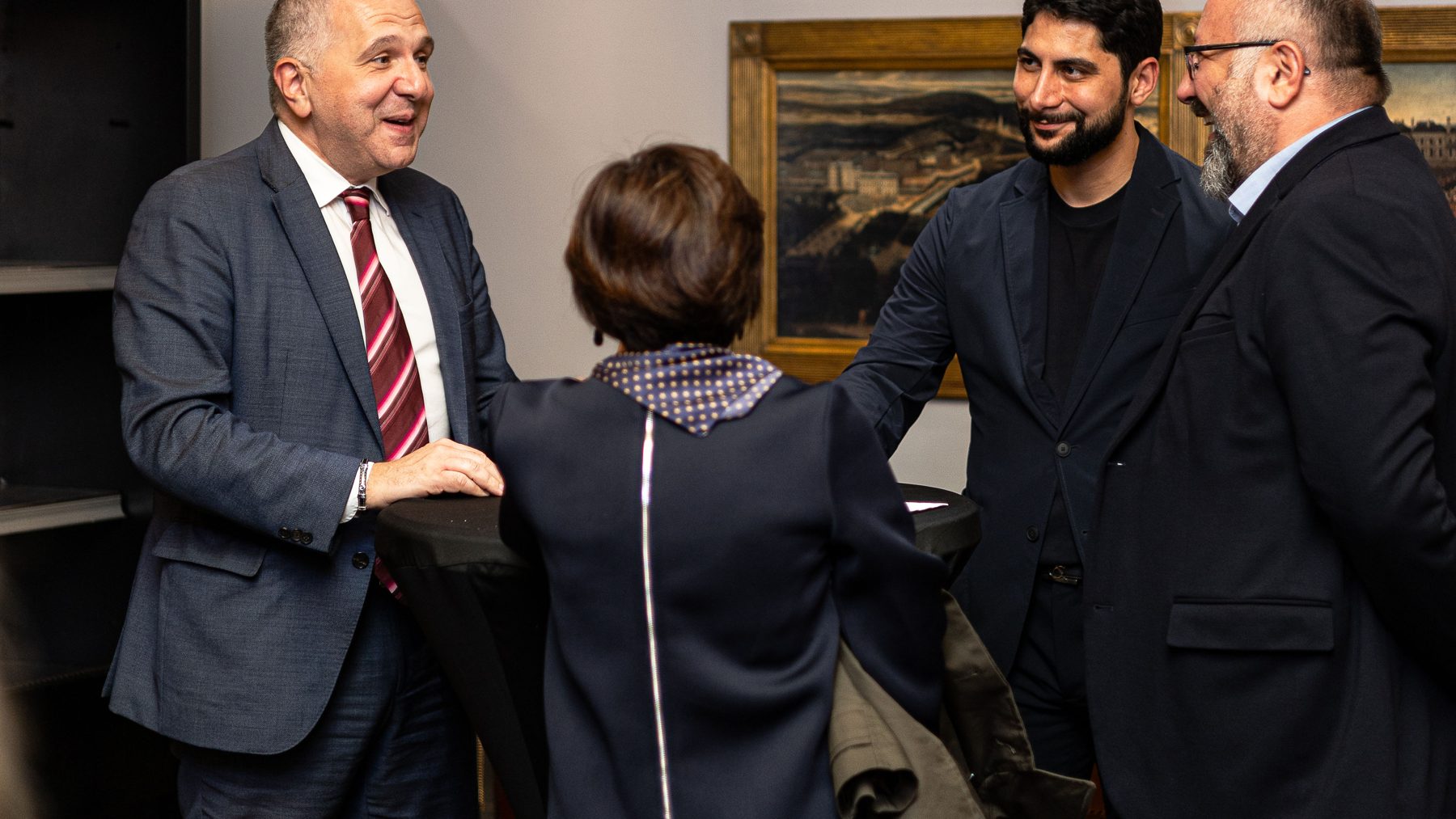 Guests talking with the FFI team after the conference