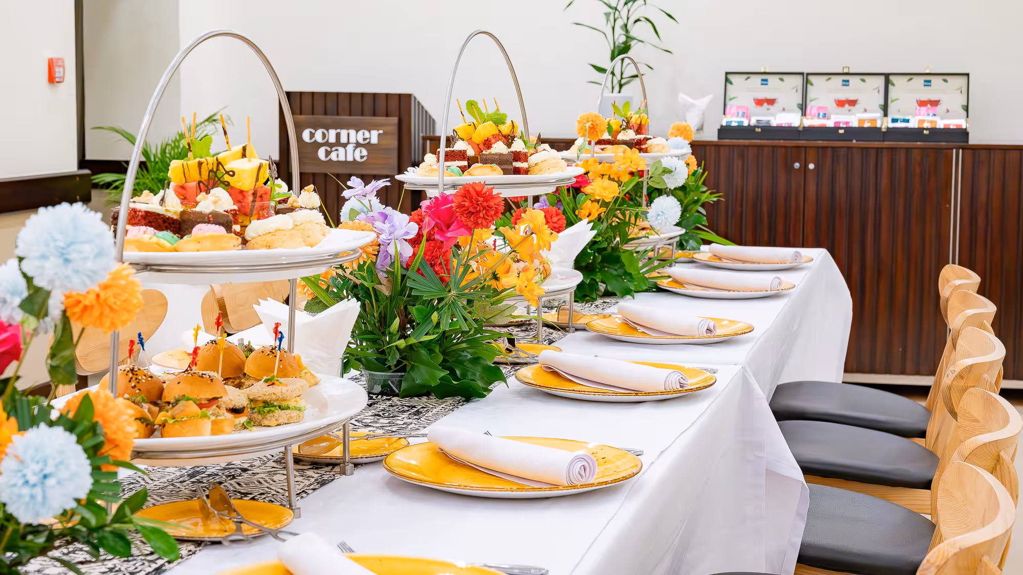 High Tea setup with tiered stands, pastries and sandwiches at Corner Cafe in Nadi