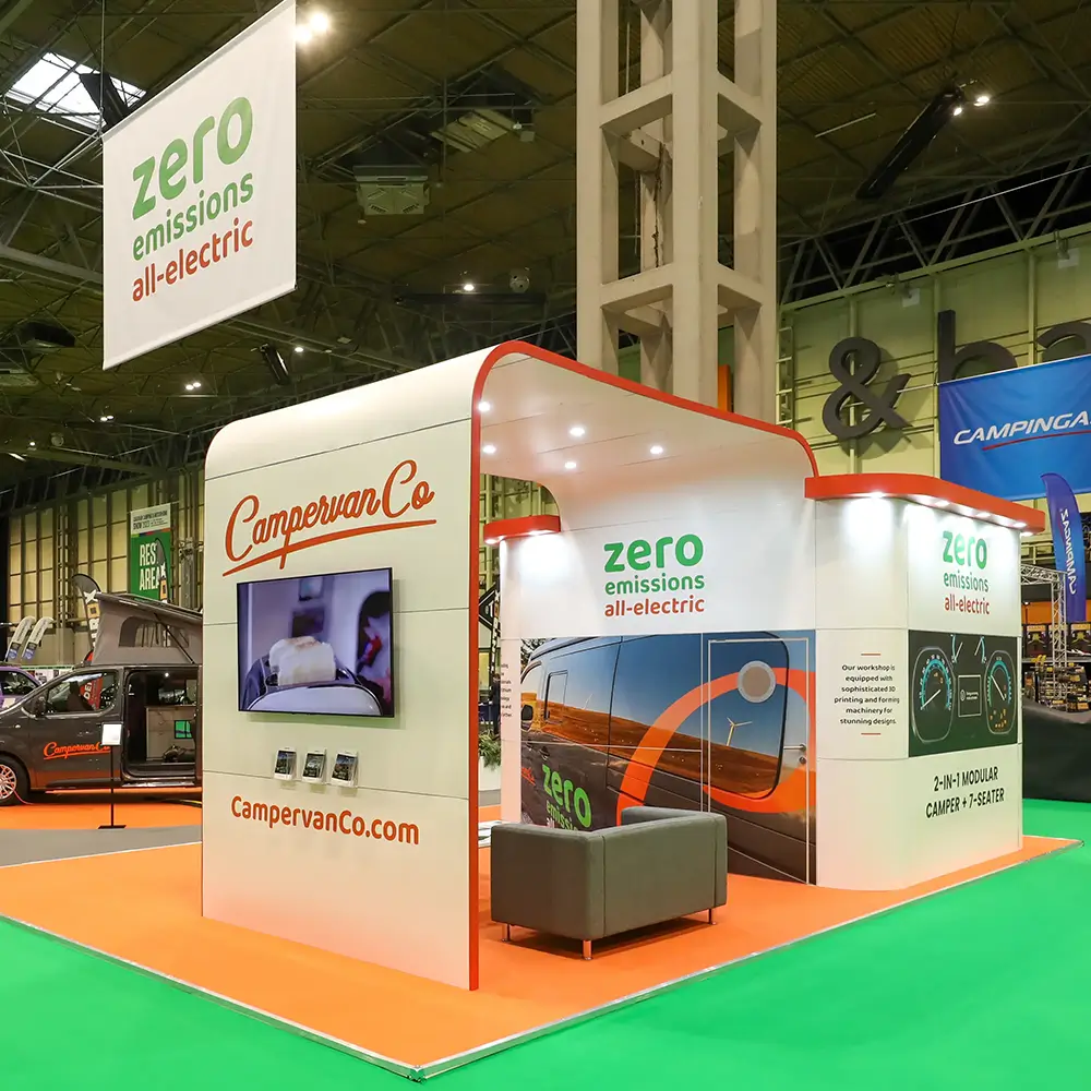 CampervanCo electric campervan exhibit with signs reading zero emissions all-electric.