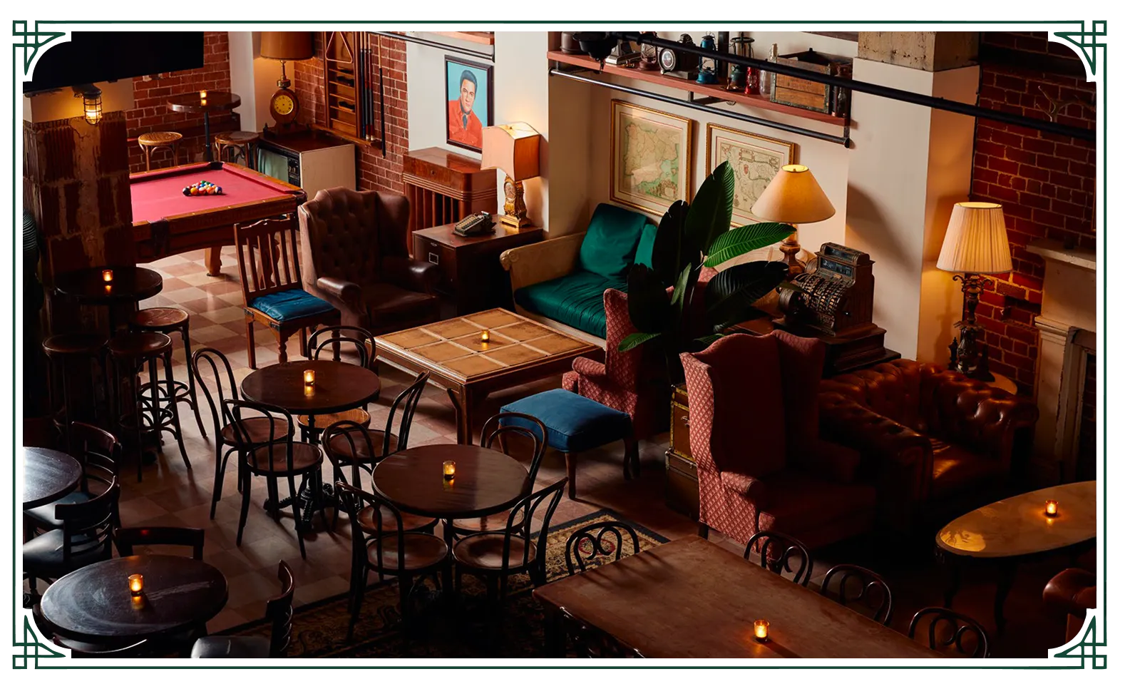 Overhead view of Lost Boy Dry Goods with a pool table, vintage sofas, bistro tables, and warm ambient lighting