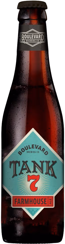 Bottle of Boulevard Brewing Co. Tank 7 Farmhouse Ale beer with droplets on the glass.