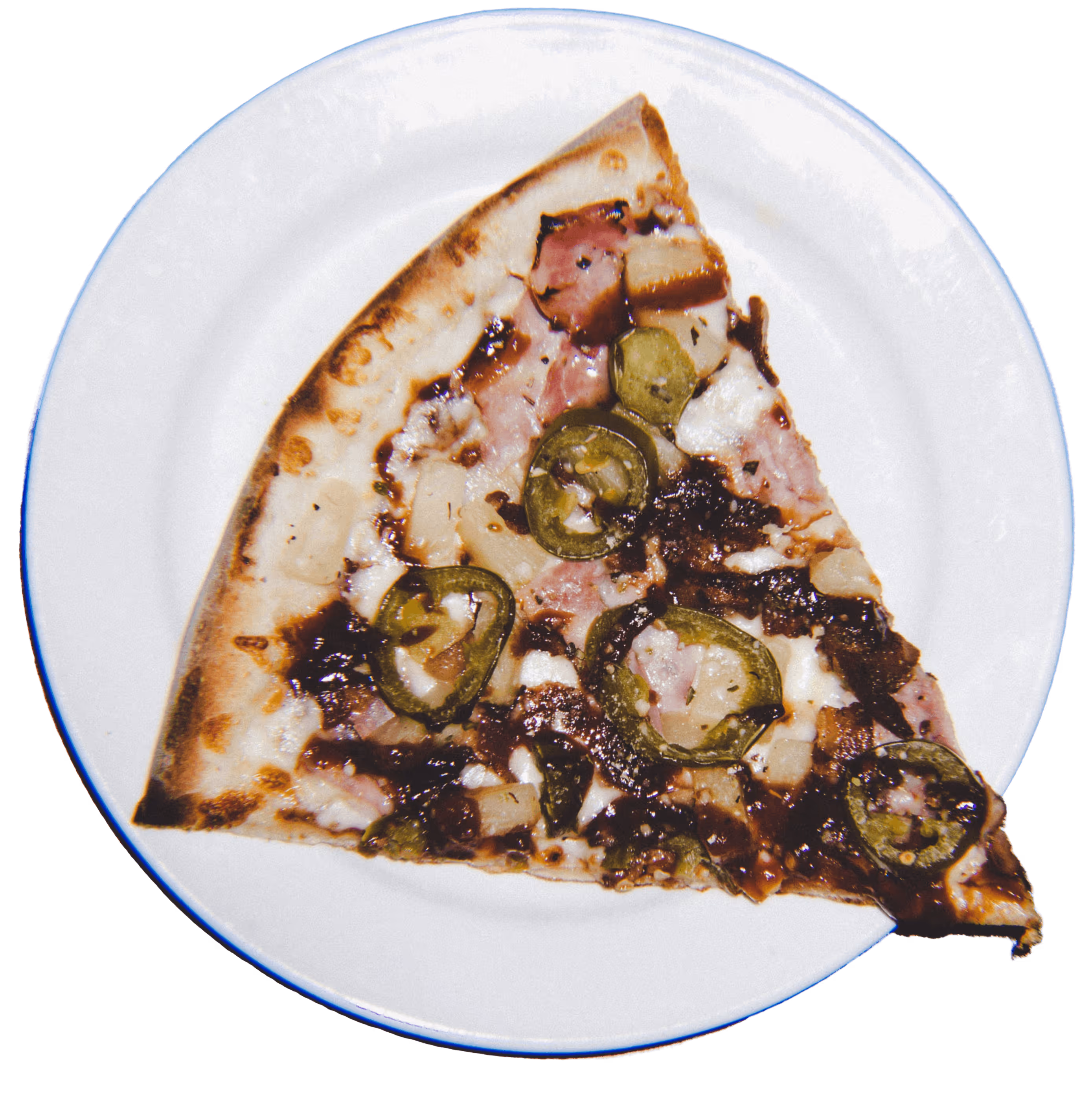 Slice of pizza with ham, pineapple, jalapeños, cheese, and barbecue sauce on a white plate.