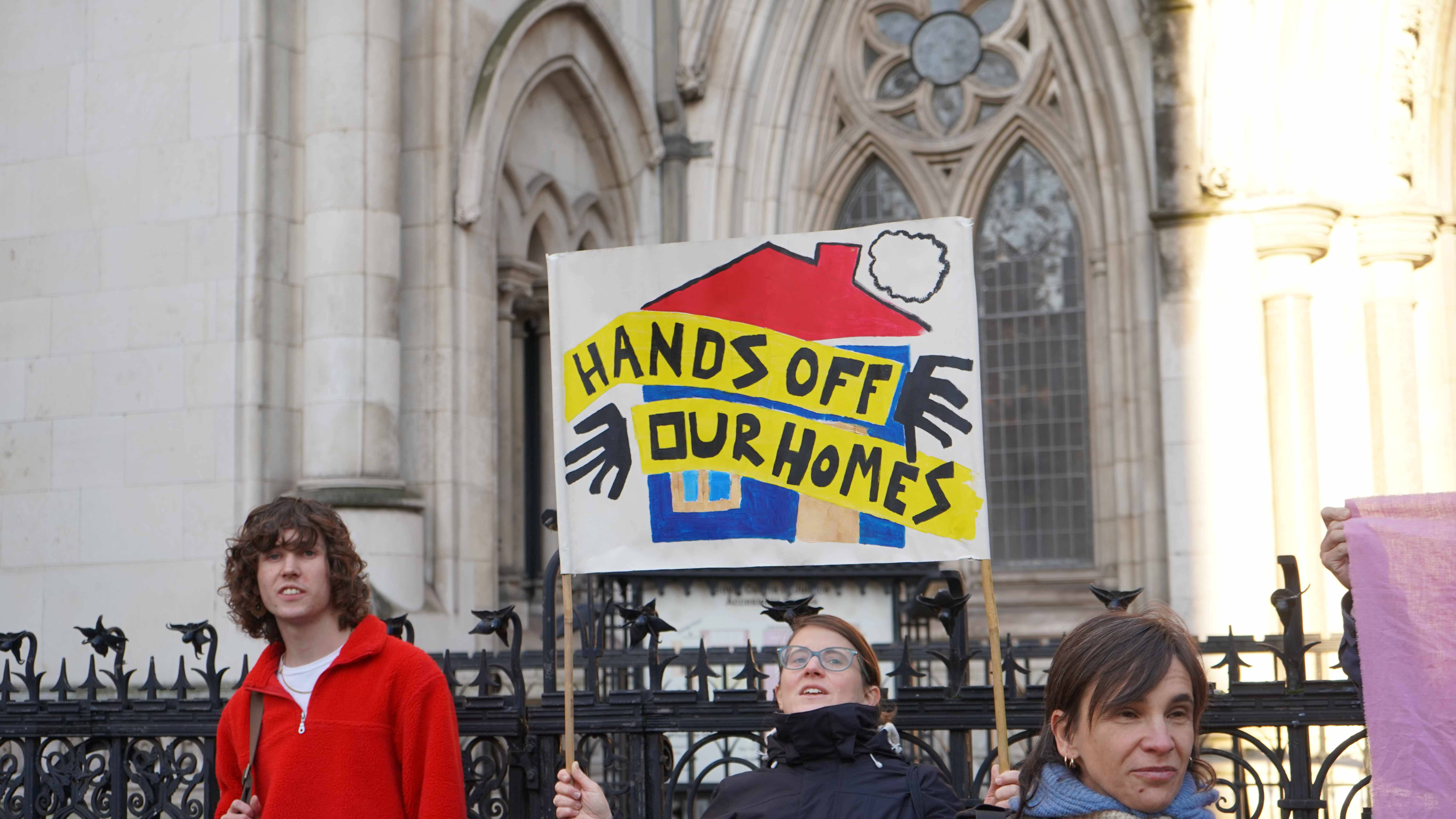Campaigners outside the Royal Courts of Justice with 'Fight for the Aylesbury', 'Refurbish Don't Demolish' and 'Homes for people not for profit' placards
