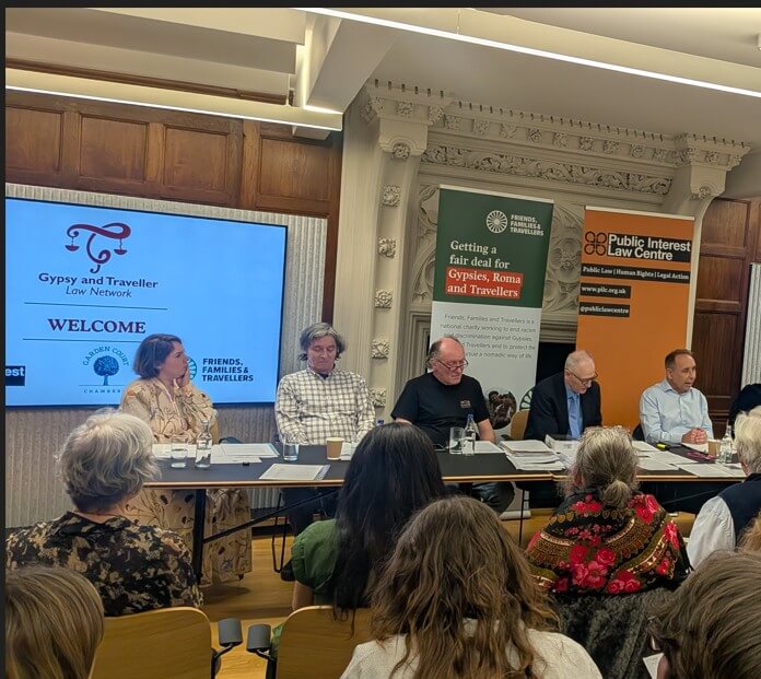 Panel discussion at the launch of the Gypsy and Traveller Law Network, with Friends, Families and Travellers and PILC banners visible
