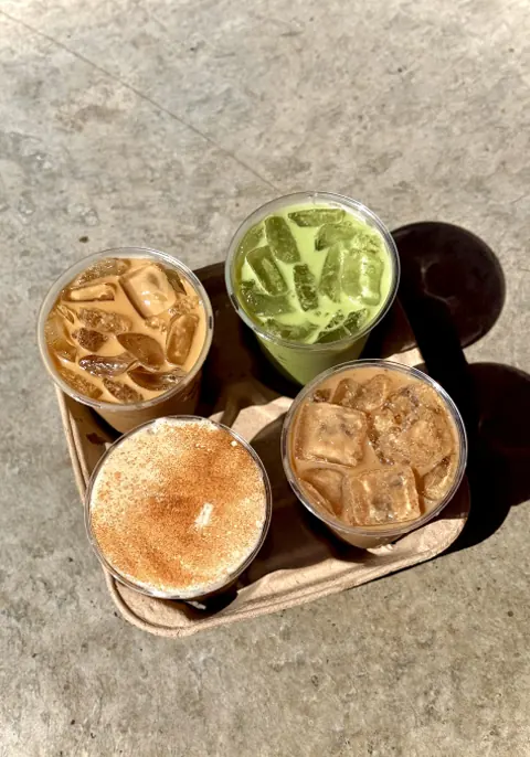togo tray with three iced coffees and one iced matcha