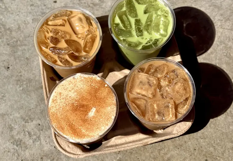 Togo tray of three iced coffees and one matcha